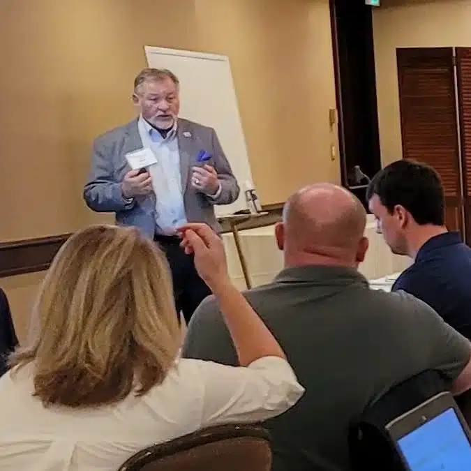 Fred Haskett speaking to a group of owners