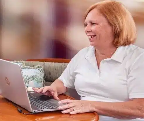 Kelly Haskett working on her laptop
