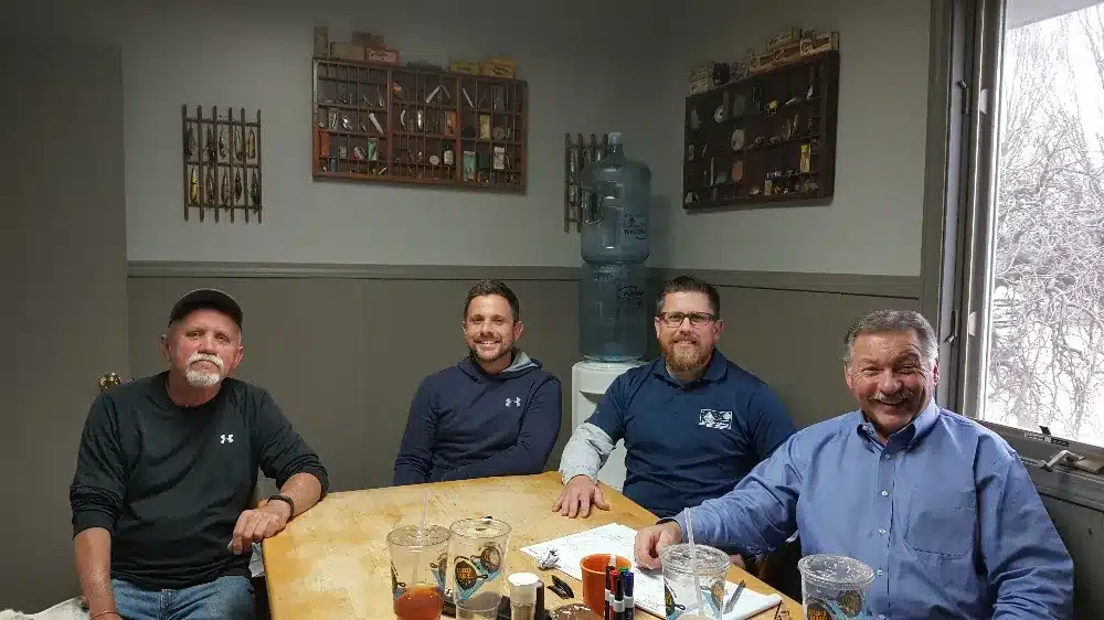 A consulting session with a small leadership team around a table